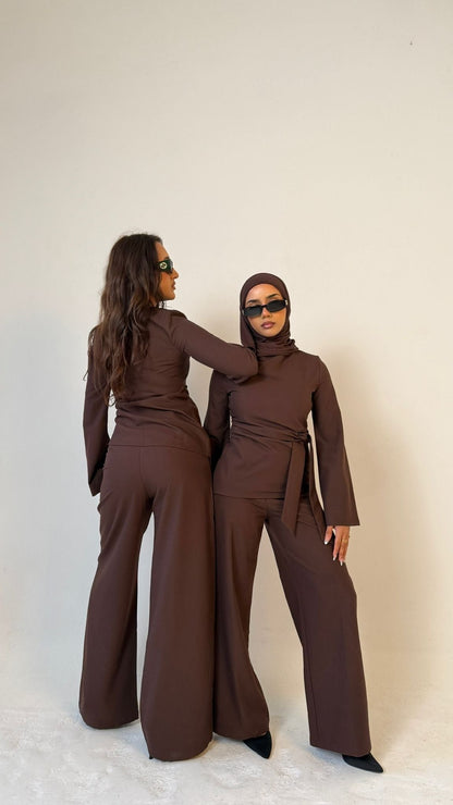Two models, one facing forwards and the other facing backwards, wearing Muse straight leg trousers in coffee brown, tailored fit for petite frames