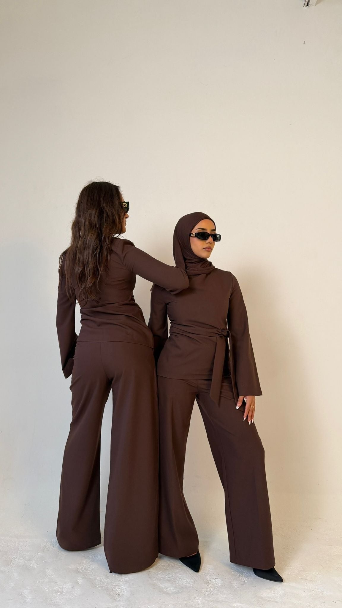 Two models posing wearing Muse straight leg trousers in coffee brown, tailored fit for petite frames