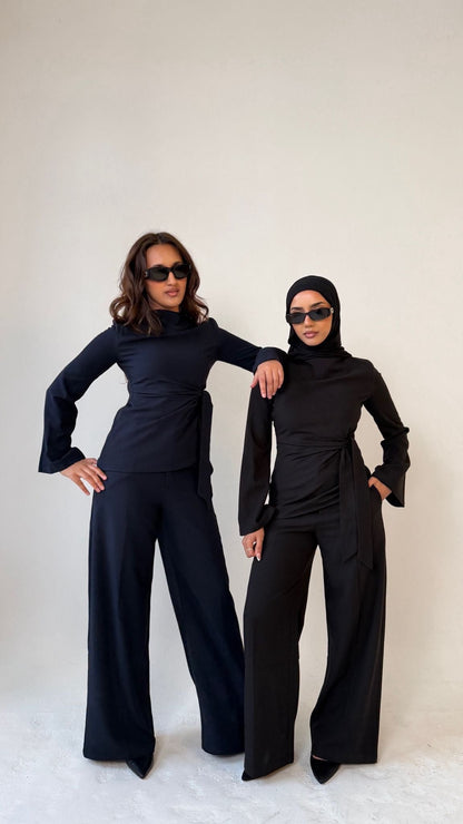 Two models facing forward wearing Muse straight leg trousers in midnight blue and noir black, tailored fit for petite frames