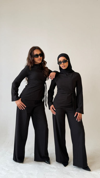 Two models facing forward wearing Muse straight leg trousers in noir black, tailored fit for petite frames