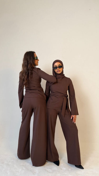 Two models, one facing forwards and one facing backwards, wearing Muse tailored tops in coffee brown, designed for petite frames with structured fit