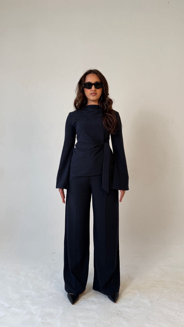 Model facing forward wearing Muse tailored top in midnight blue, designed for petite frames with structured fit
